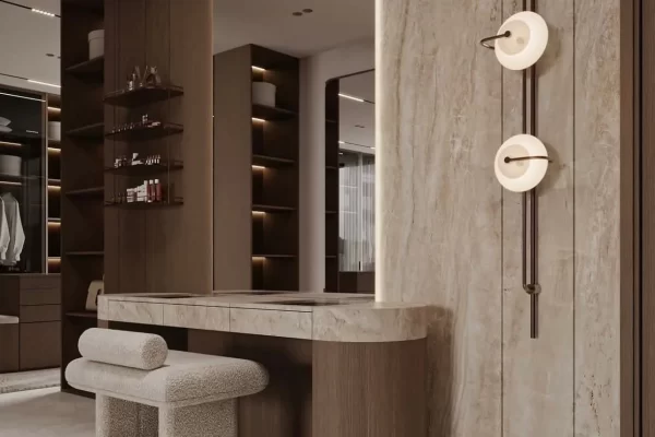 Dressing area in a 3 BHK home at Kalpavruksha, Thane - travertine wall panelling with a floating vanity and open shelving